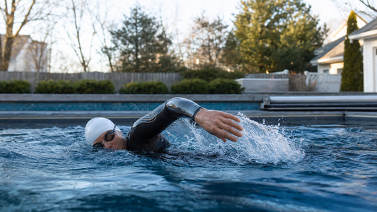 A man is swimming in a pool