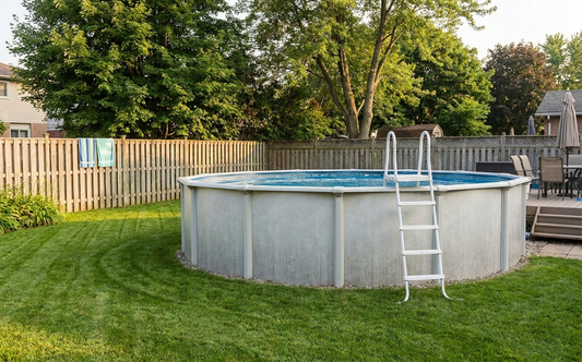 A typical mid-size above ground pool in a residential backyard